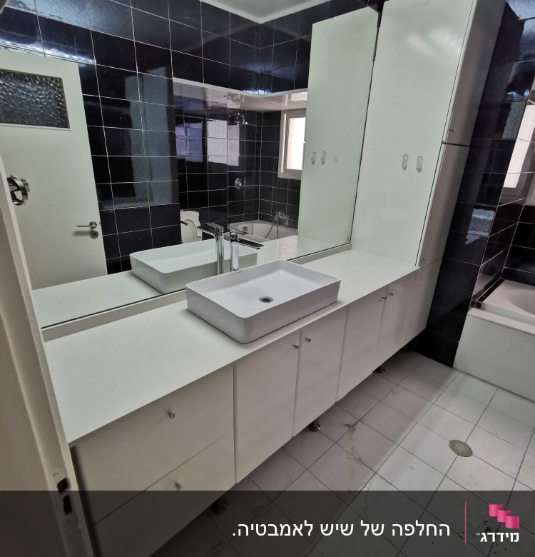 Bathroom with white marble countertop and sink